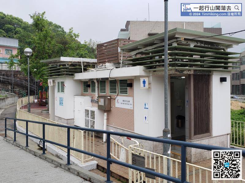 To reach the Tong Hang Village public toilet, continue along the road.